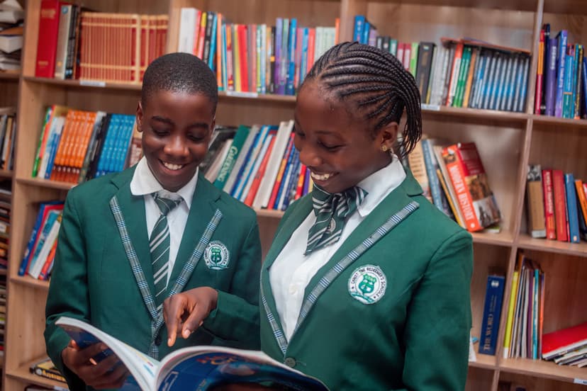 Students smiling in the library